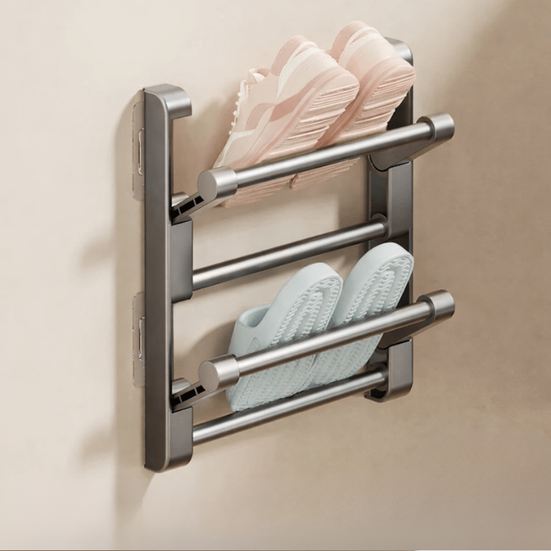 Wall-mounted shoe rack with two pairs of shoes on a beige background