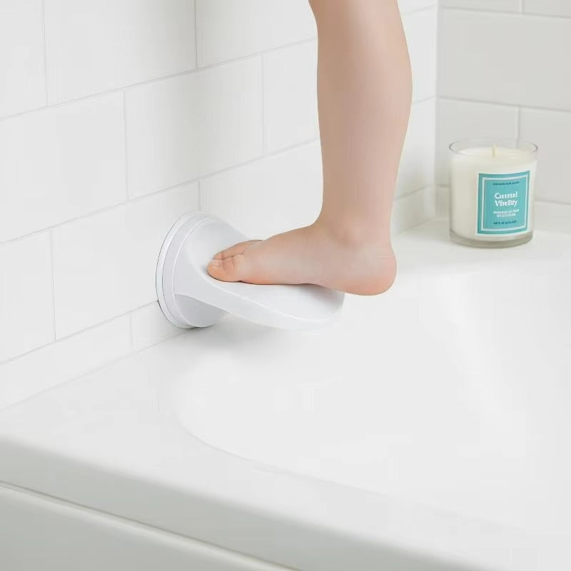 Person using a white non-slip mat on a bathtub ledge with a candle in the background.