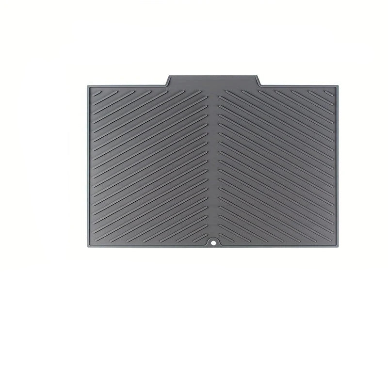 Gray textured mat with a chevron pattern on a white background