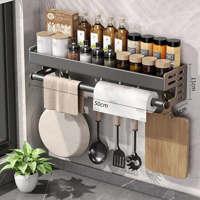 Wall-mounted kitchen organizer with shelves, bottles, and utensils in a kitchen setting.