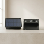Solar-powered outdoor light fixture with solar panel on a neutral background