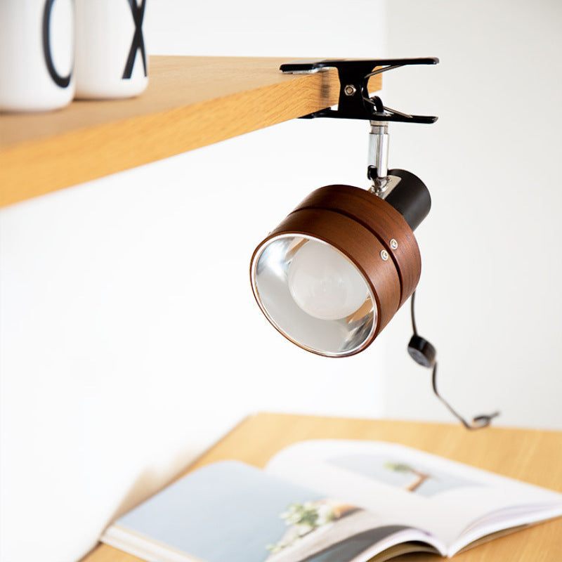 Brown clamp lamp on a desk with an open book