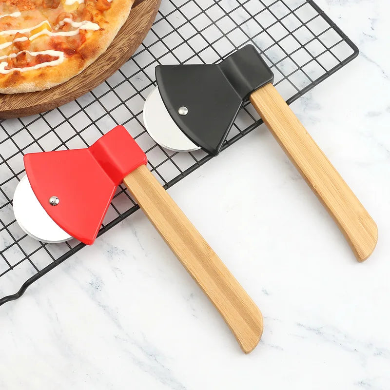 Two pizza peel tools with wooden handles on a cooling rack with a pizza in the background.