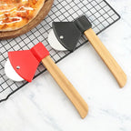 Two pizza peel tools with wooden handles on a cooling rack with a pizza in the background.