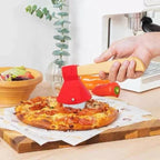 Person using a pizza cutter on a pizza with a kitchen setting in the background