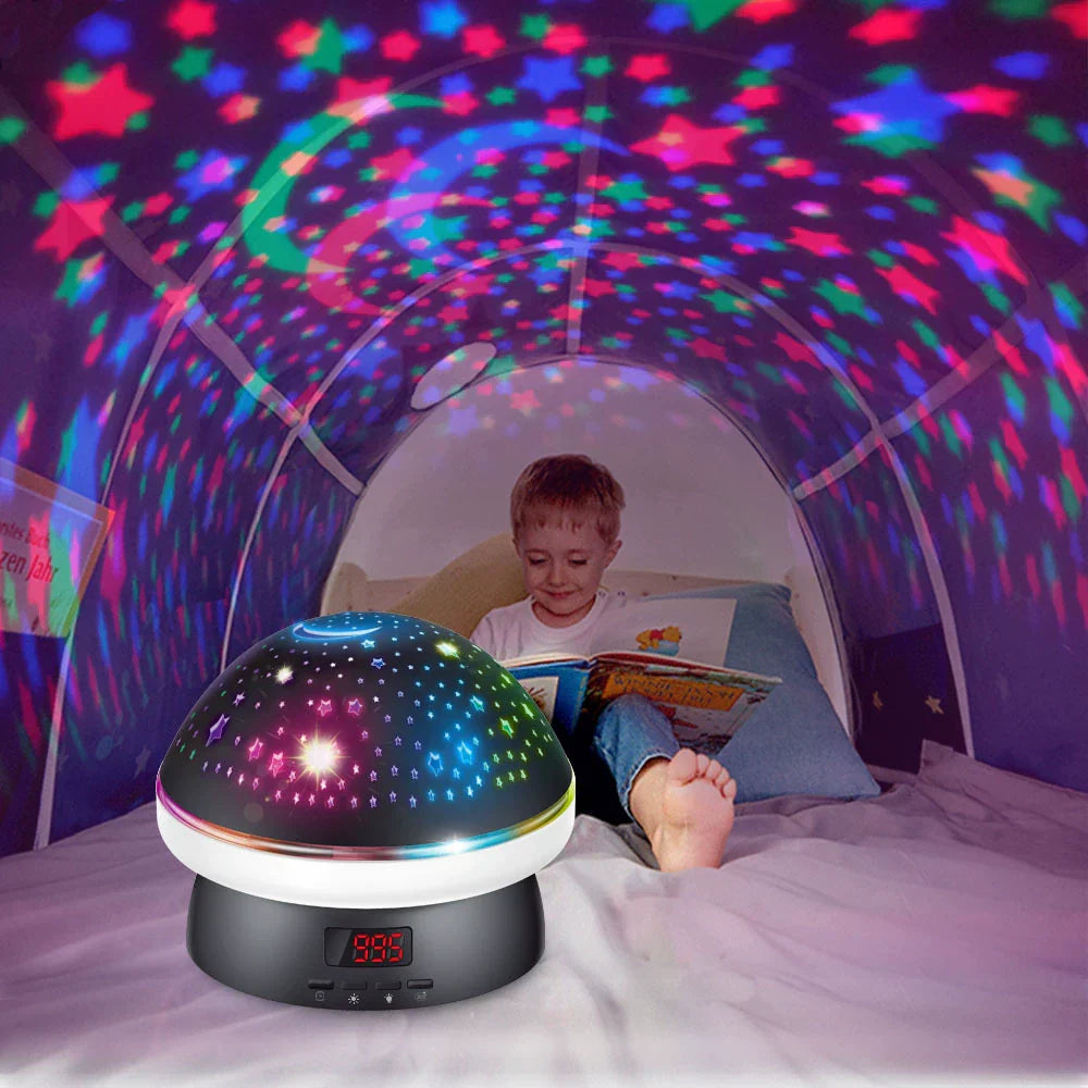 Child reading a book under a colorful starlight projector in a bed.