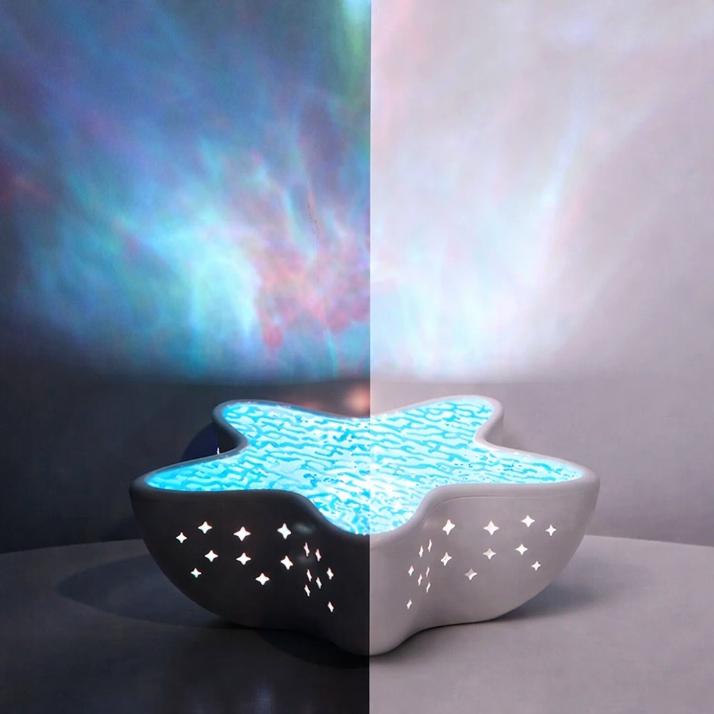 Star-shaped night light projecting a colorful nebula pattern on a wall.