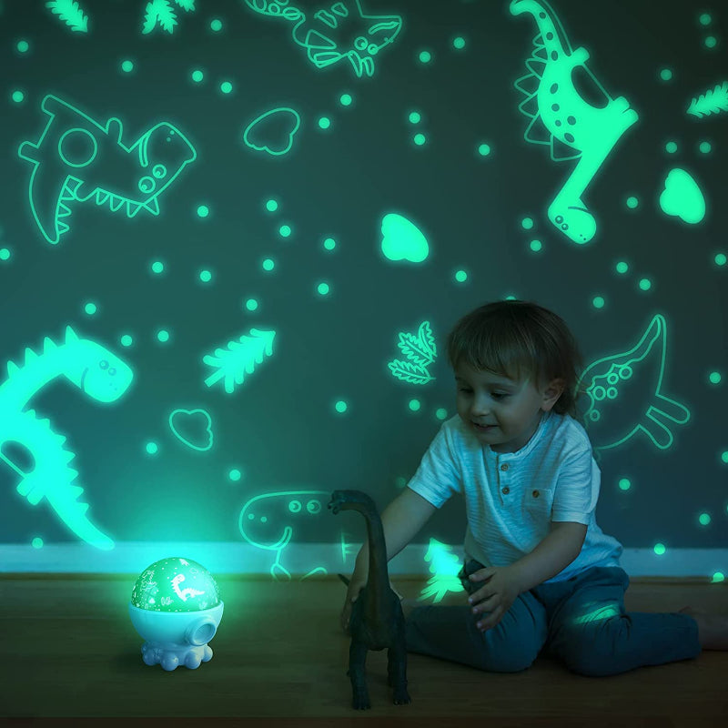Child playing with a dinosaur toy in front of a wall with dinosaur decals and a glowing night light.