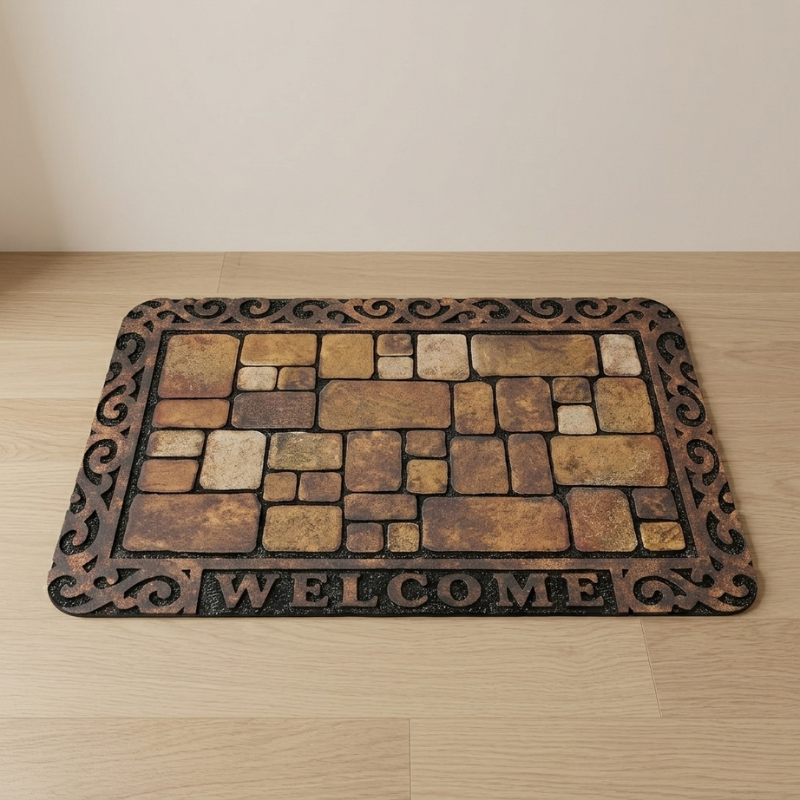 Decorative doormat with stone pattern and 'WELCOME' text on a wooden floor.