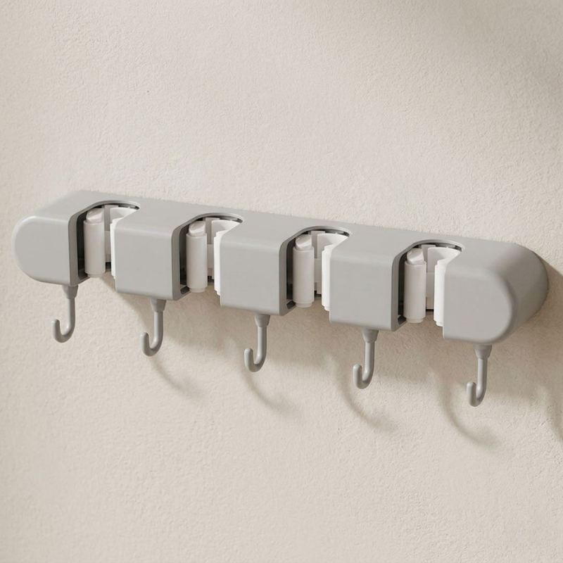 Wall-mounted hook with five hooks on a plain wall