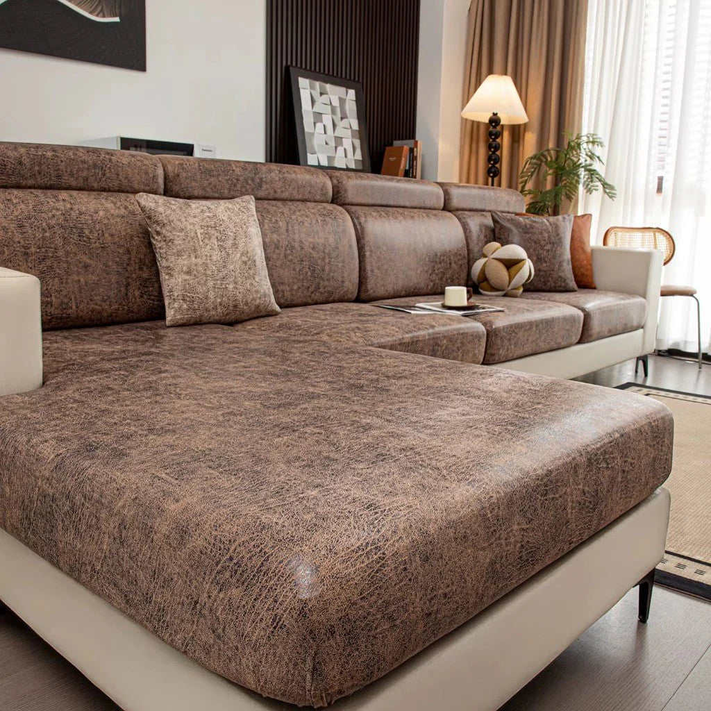 Brown sectional sofa in a living room setting with decor elements.