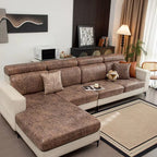 Brown sectional sofa in a living room setting with decor elements.