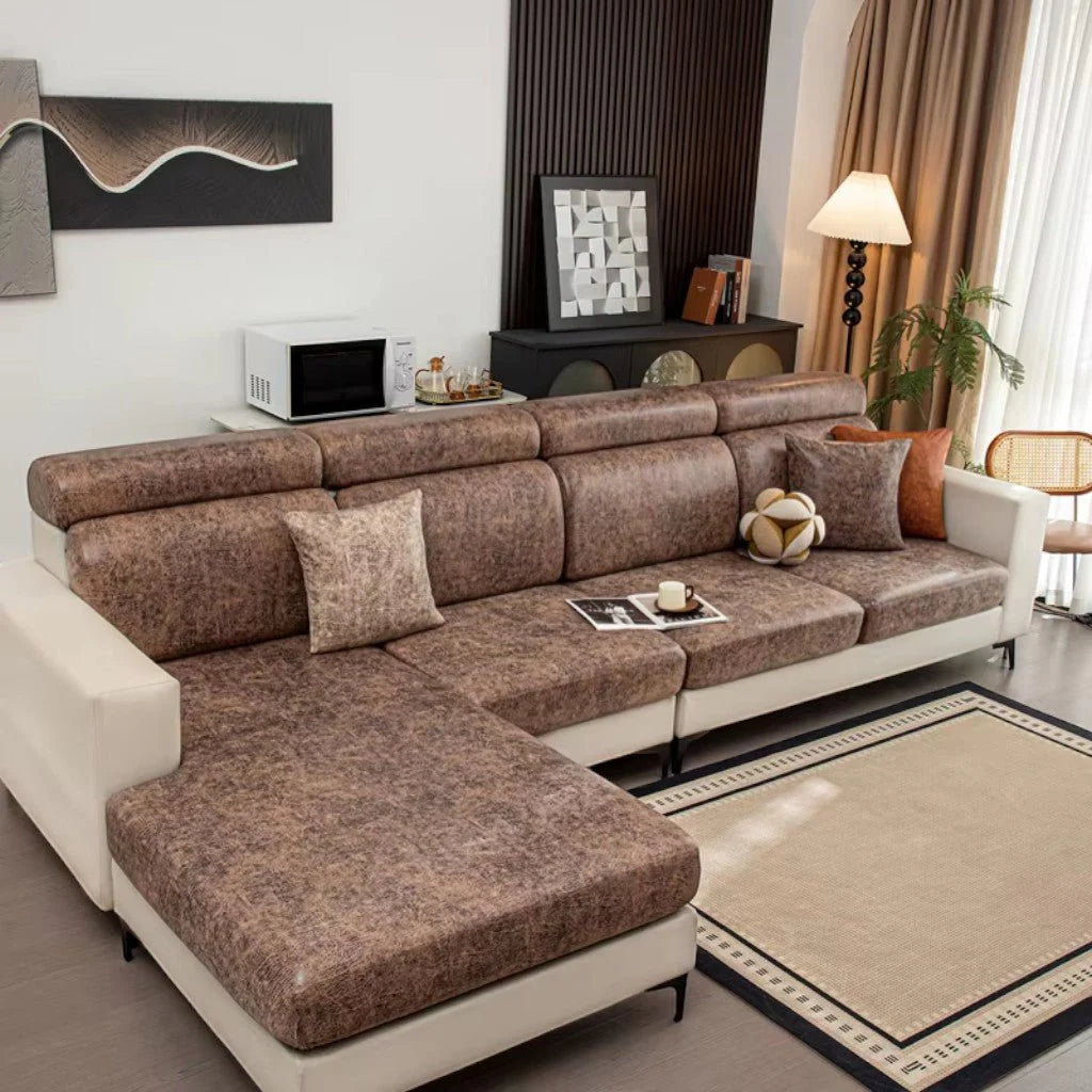 Brown sectional sofa in a living room setting with decor elements.