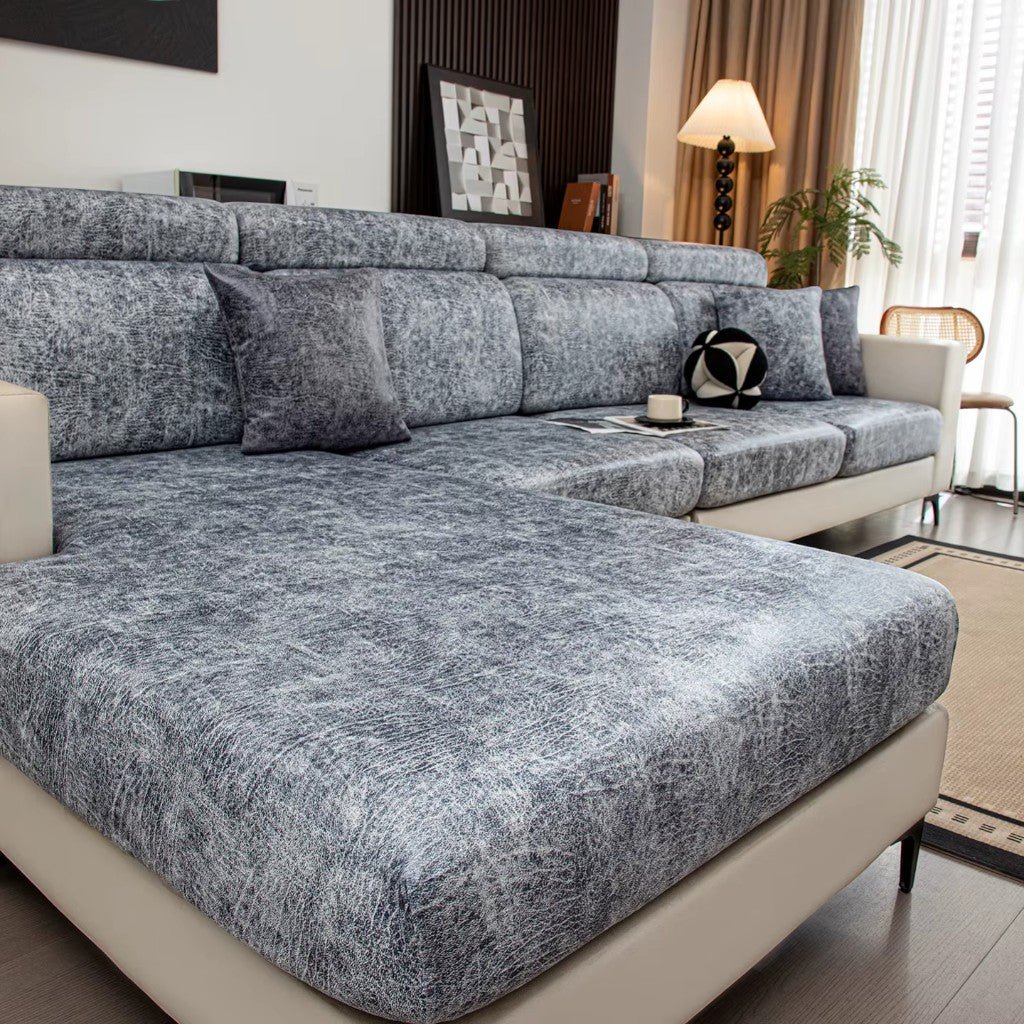 Gray textured sectional sofa in a living room setting with decor elements.