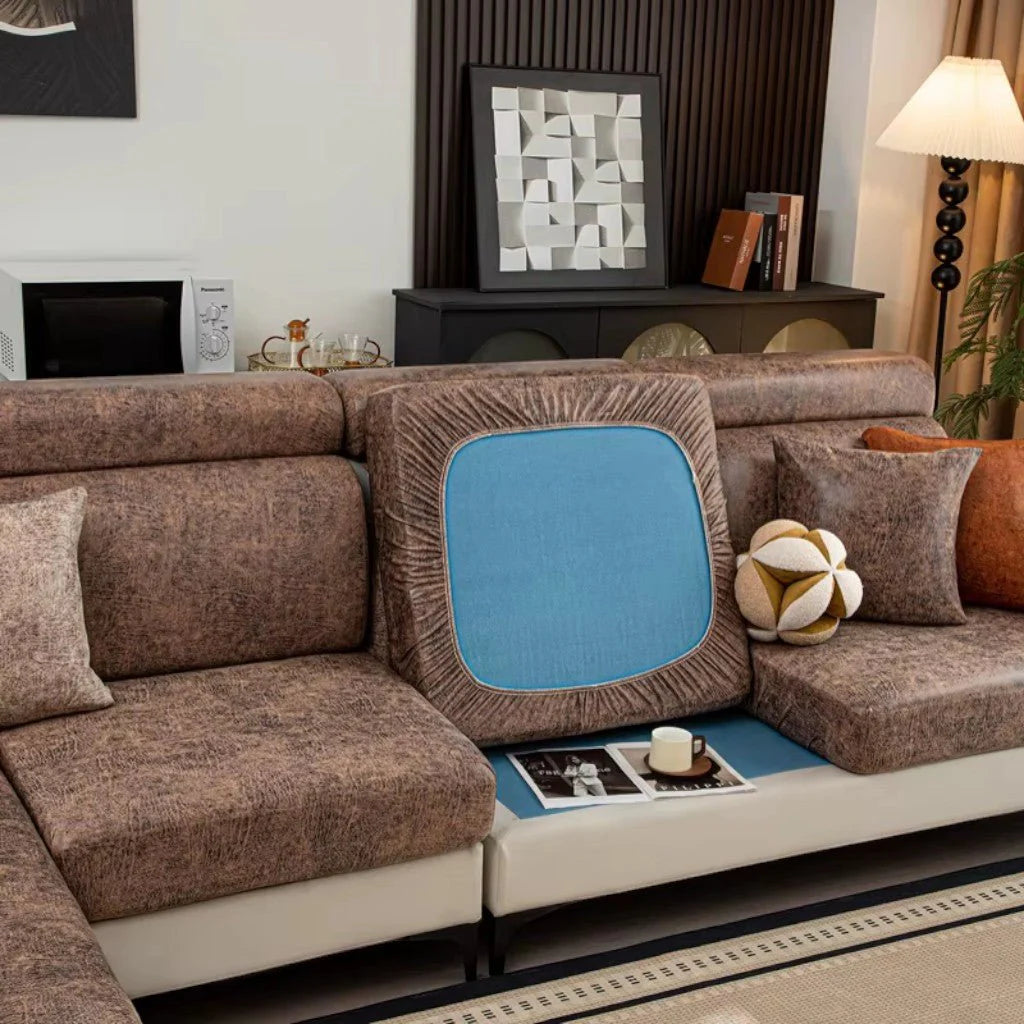 Brown sectional sofa with decorative cushions in a living room setting.