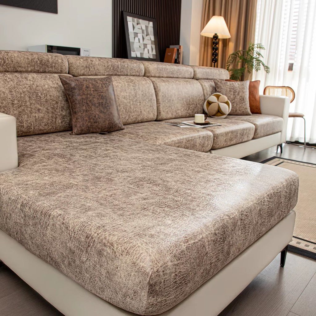 Beige sectional sofa in a living room setting with decor elements.