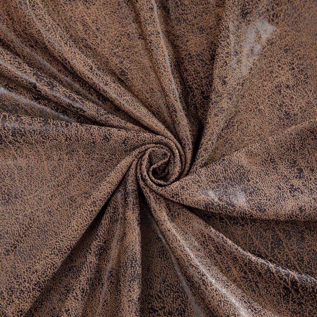 Close-up of brown textured fabric with a swirl pattern