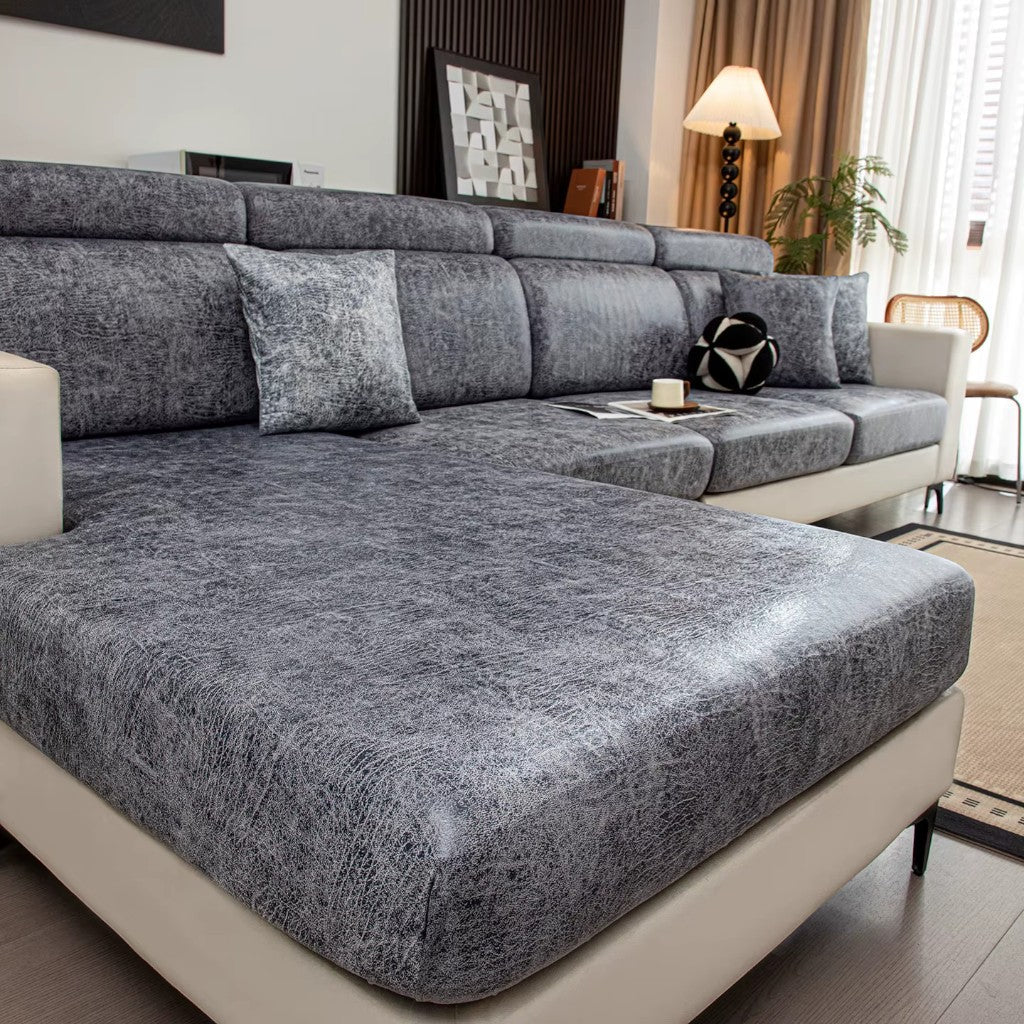 Gray sectional sofa in a living room setting with decor elements.