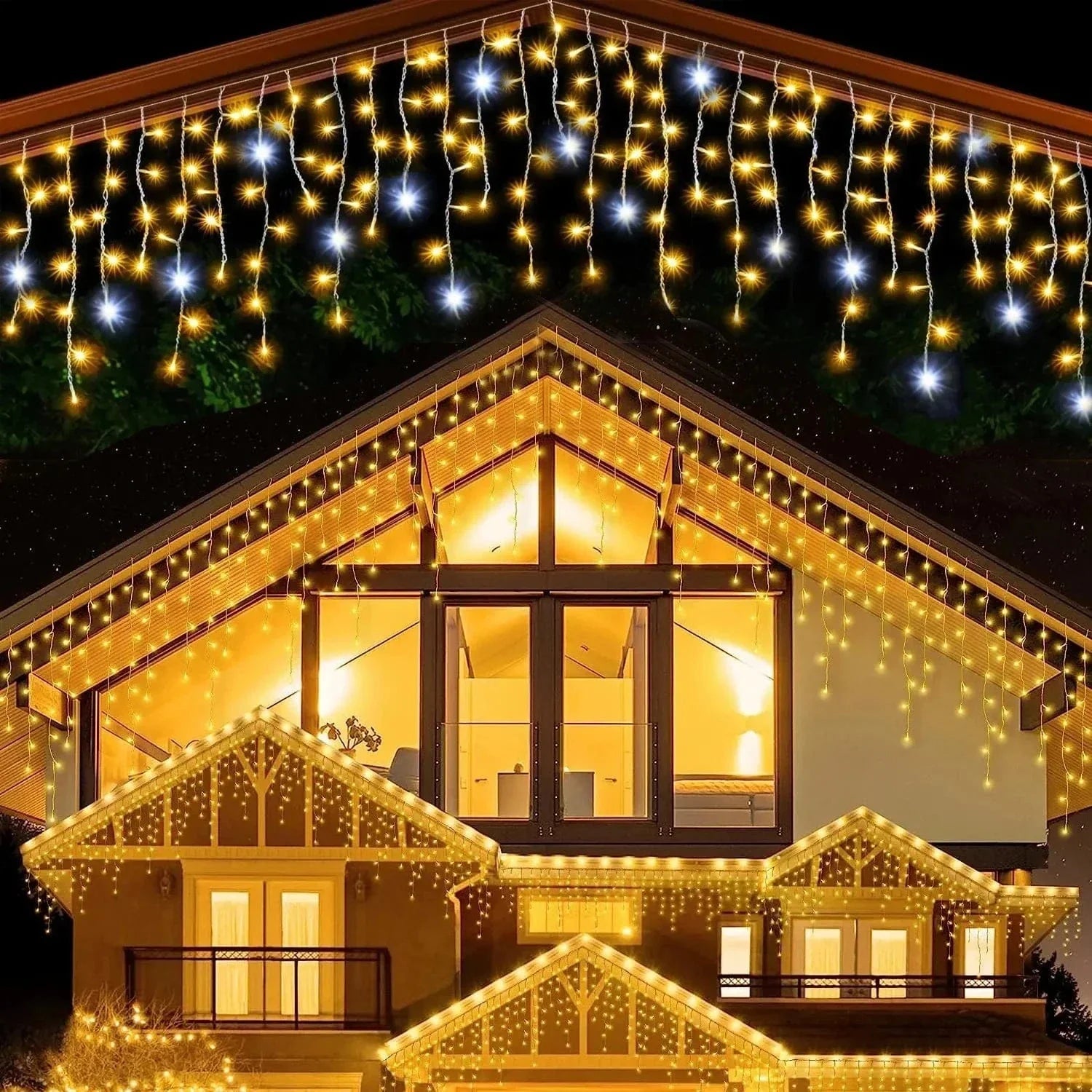 House exterior with string lights draped over the roof and windows at night.