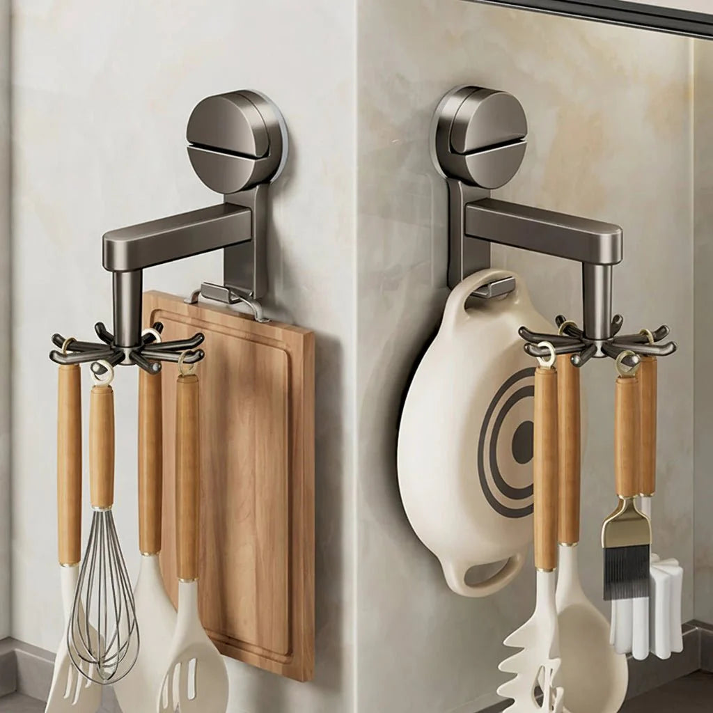 Wall-mounted kitchen organizer with cutting board, whisk, spatula, and other utensils.