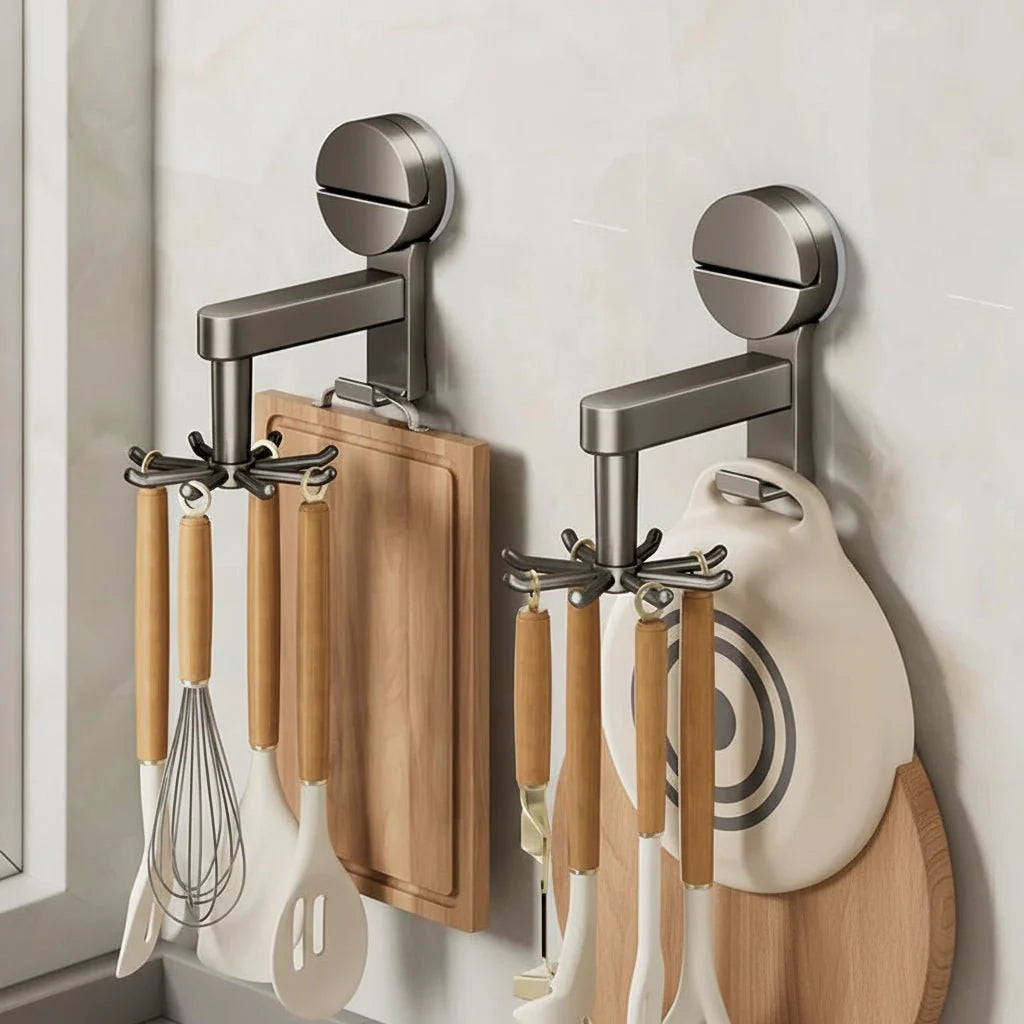 Wall-mounted kitchen organizer with cutting boards, utensils, and a whisk.