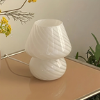 White textured lamp on a surface with a neutral background