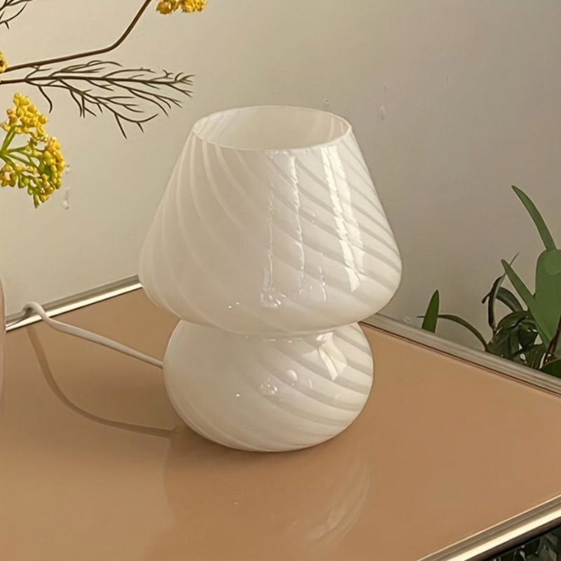White textured lamp on a surface with a neutral background