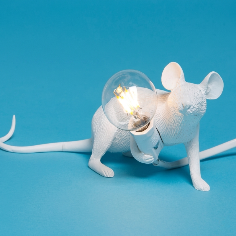 White mouse-shaped lamp with a light bulb on a blue background