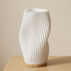 White textured vase on a wooden surface with a beige background