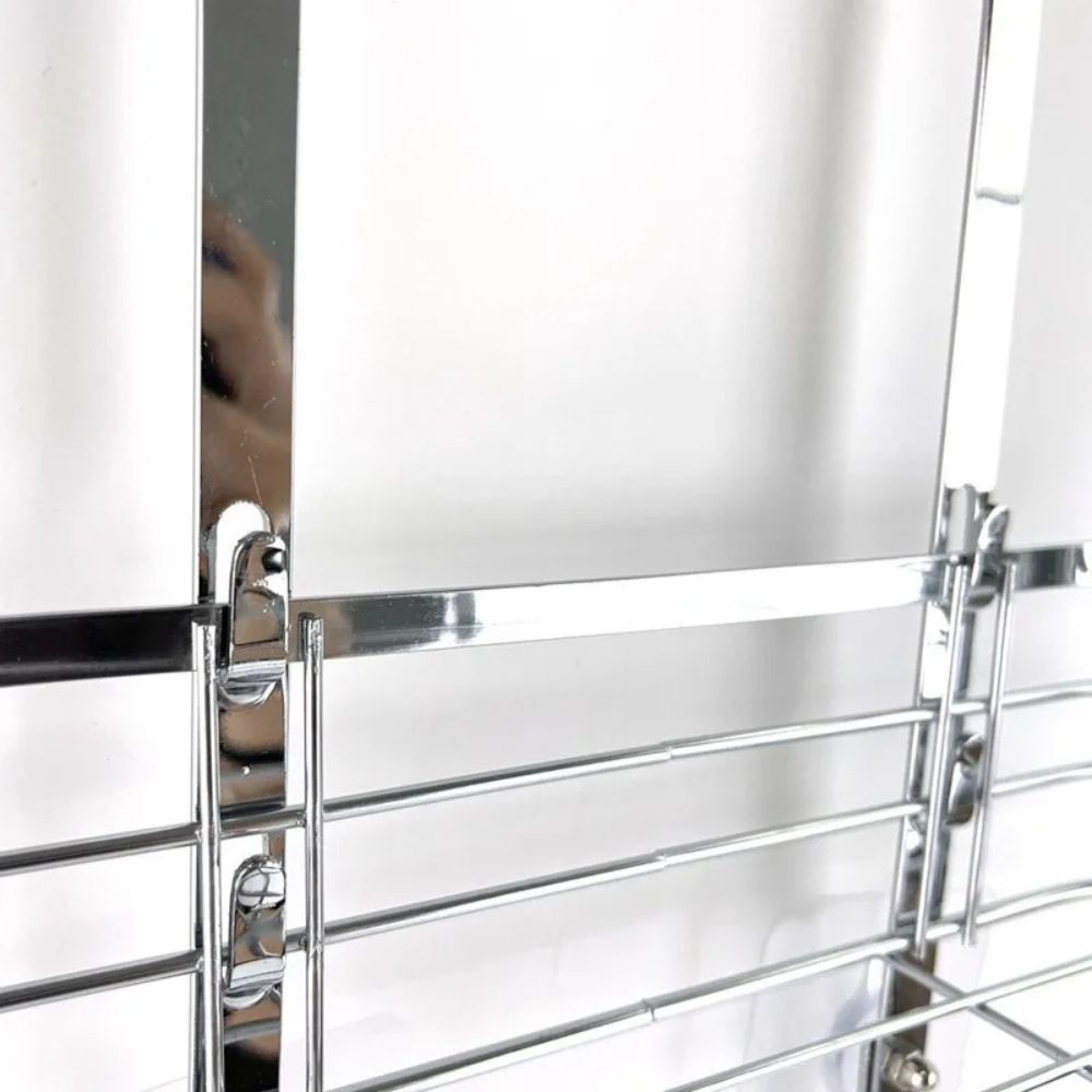 Metallic ladder with reflective surface against a white background