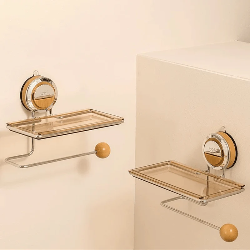 Two glass shelves with metal brackets on a beige wall.