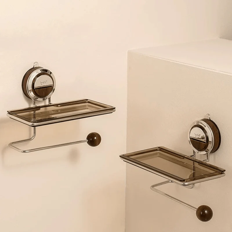 Bathroom shelves with soap dish and towel holder on a beige wall.