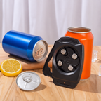 Black four-socket charging hub with cans and a lemon on a wooden surface