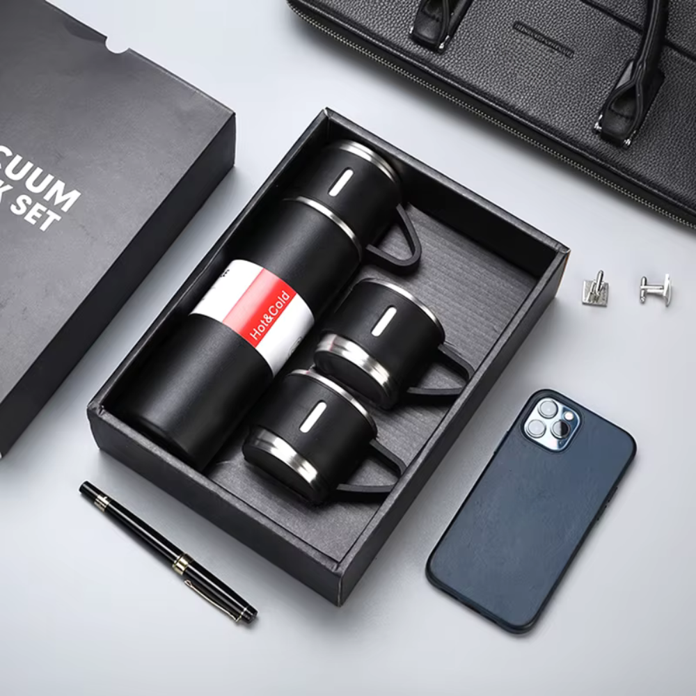 Vacuum mug set with phone case and pen on a light gray background