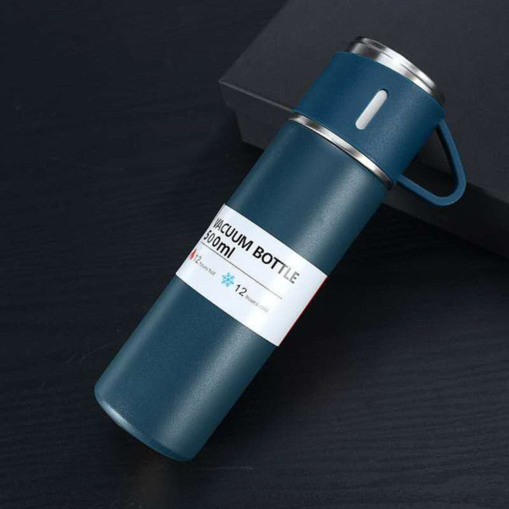 Blue vacuum bottle with a label on a dark background