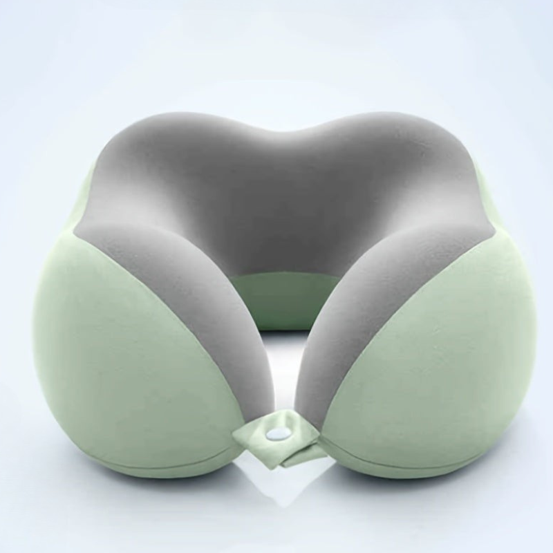 A U-shaped neck pillow with a dual-tone design, featuring a light sage green exterior and a medium gray interior, shown on a clean white background.