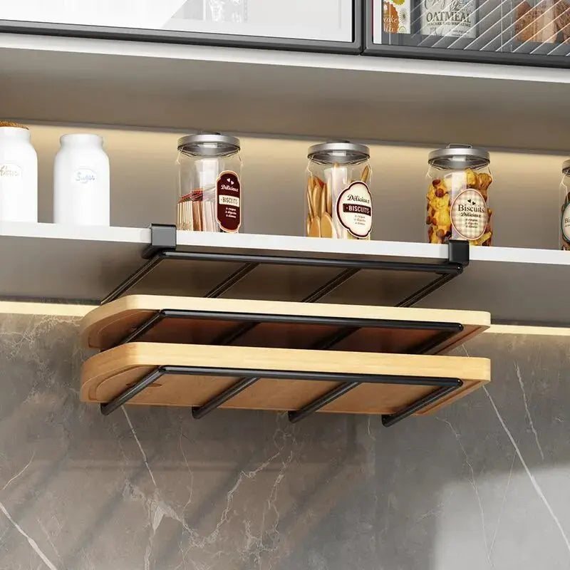 Foldable shelf attached to a kitchen cabinet with jars on a marble countertop.