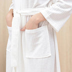 White textured robe with a pocket on a beige background