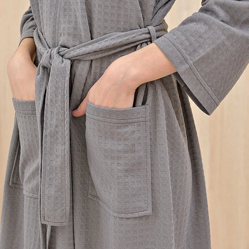 Gray robe with pockets on a beige background