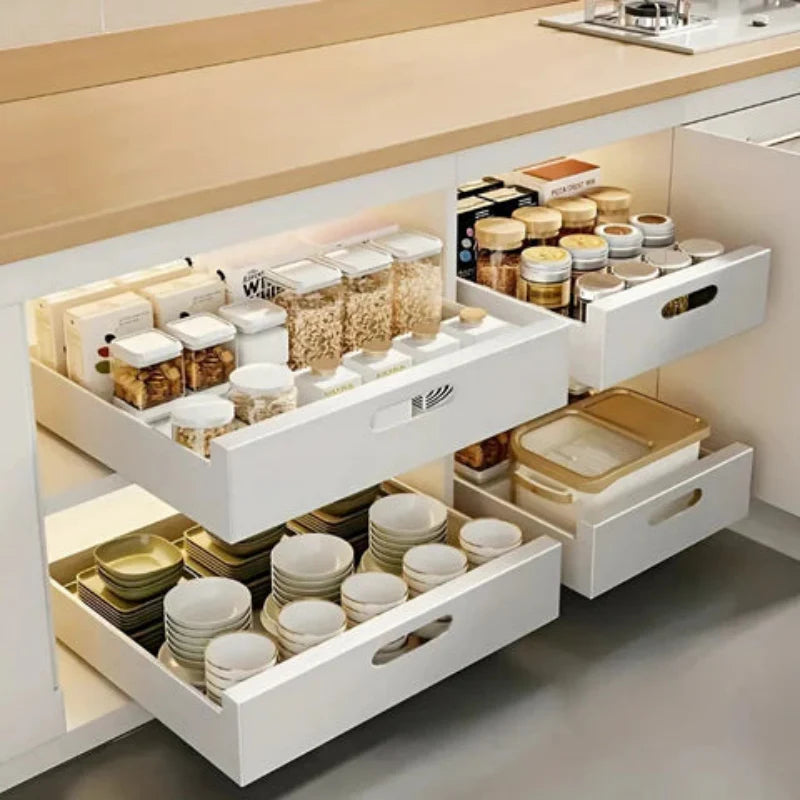 Kitchen drawer system with organized storage of kitchenware and supplies.