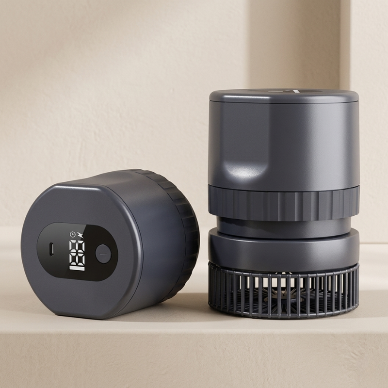 Two black cylindrical devices on a beige surface