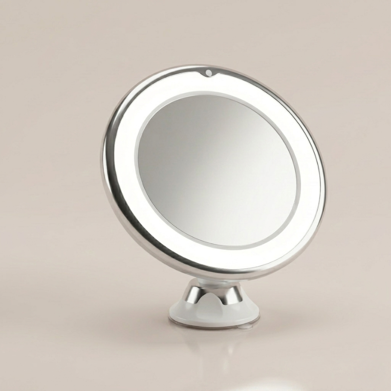 Round makeup mirror with a stand on a beige background
