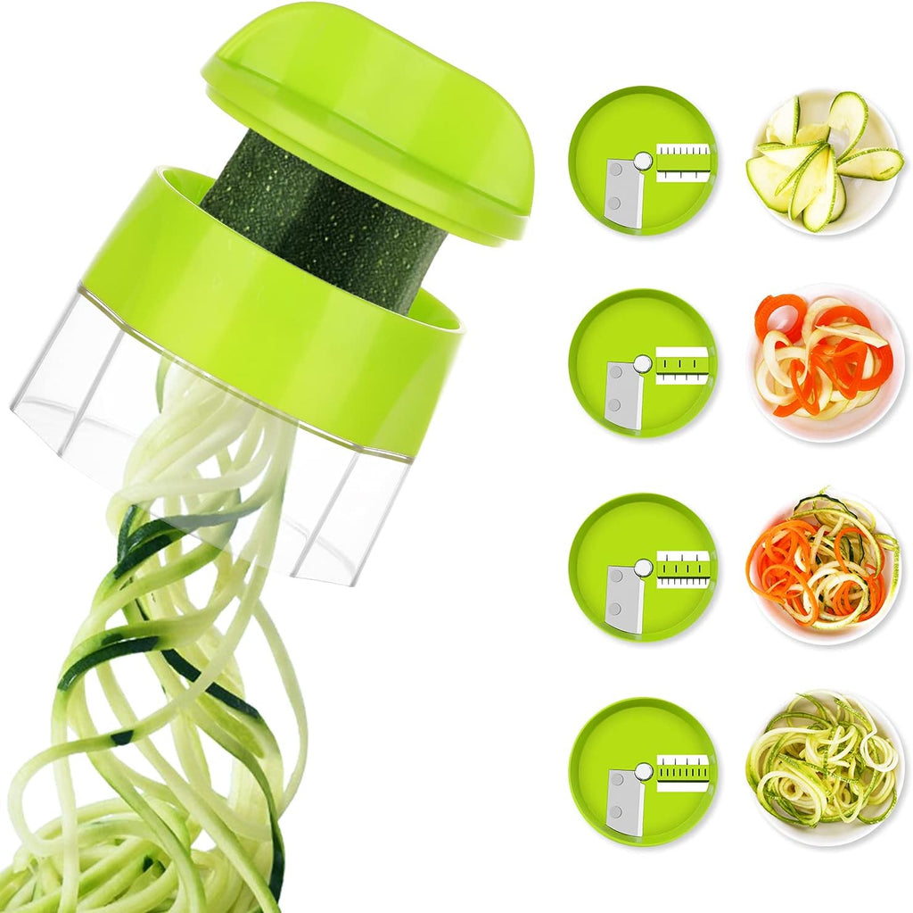 Green spiralizer with zucchini noodles and vegetable slices on a white background