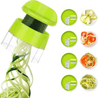 Green spiralizer with zucchini noodles and vegetable slices on a white background