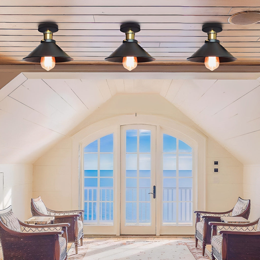 Living room with arched window and three ceiling lights.