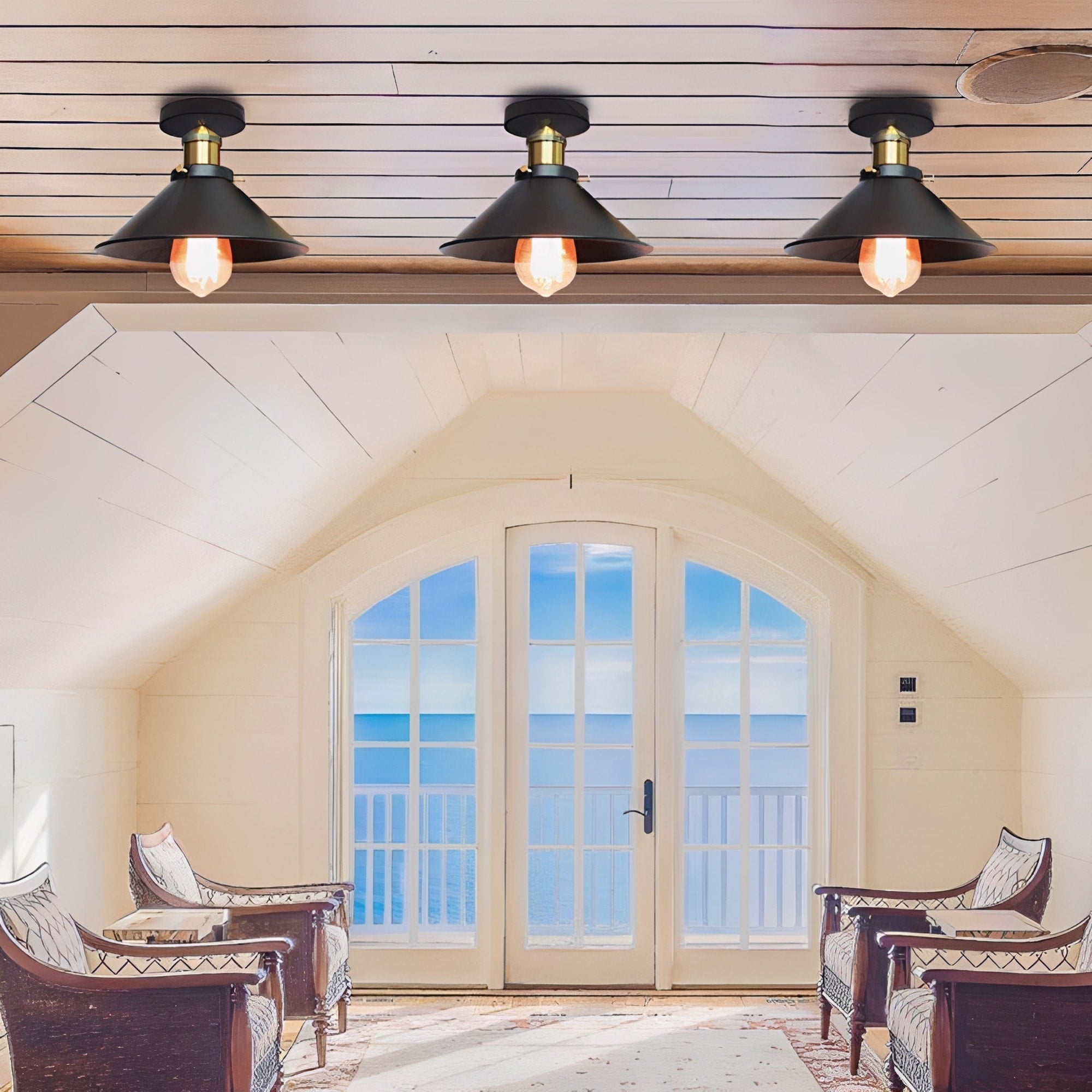 Living room with arched window and three ceiling lights.