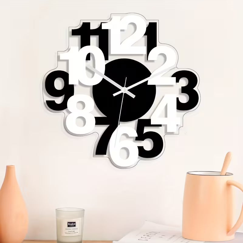 Modern wall clock with black and white design on a light background