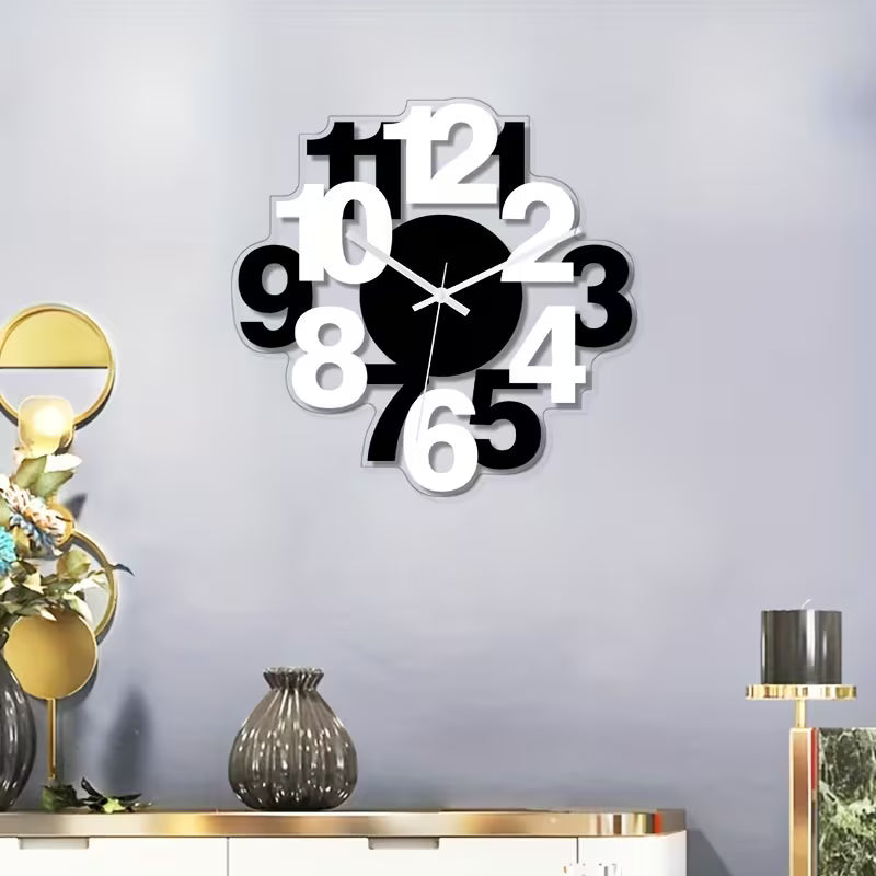Modern wall clock with black and white design on a gray wall