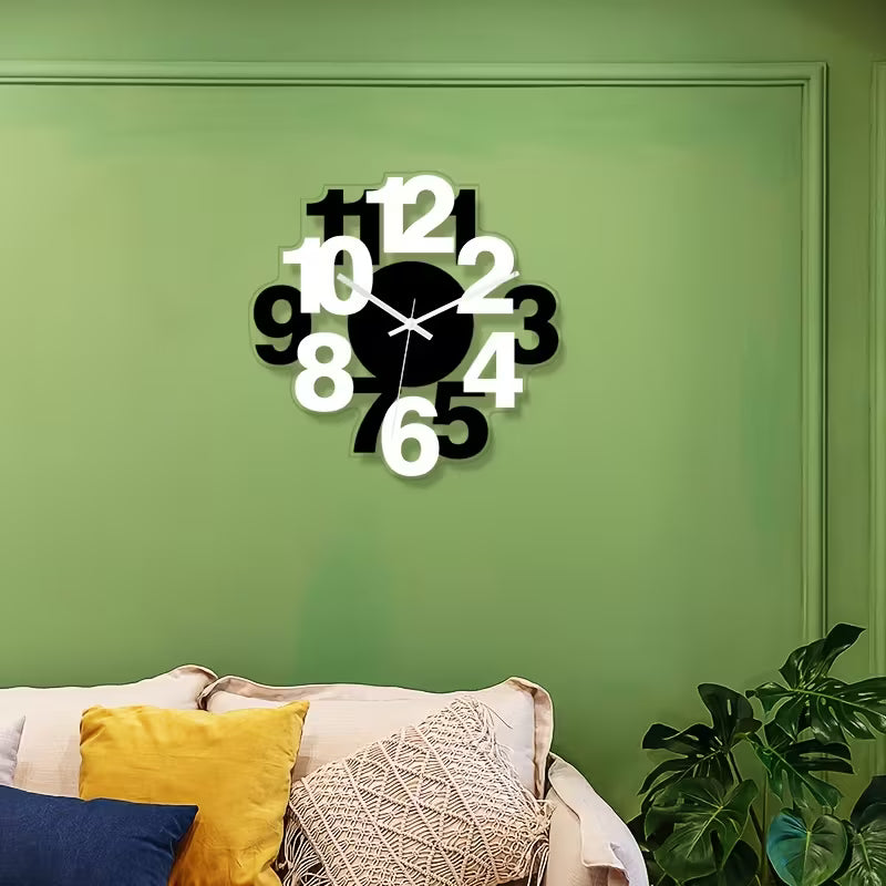 Decorative wall clock on a green wall with a couch and plant in the foreground