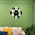 Decorative wall clock on a green wall with a couch and plant in the foreground